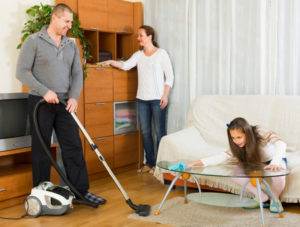 Family Cleaning Their Home