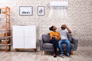 Couple On Couch Under Ductless Ac